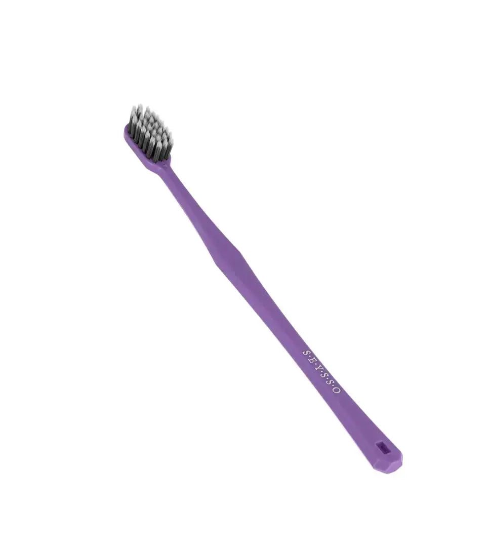 SEYSSO Carbon Antibacterial Manual Toothbrush in purple color, designed for effective teeth cleaning and gum health.