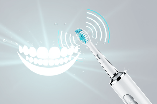 Benefits of sonic toothbrush demonstrated with an electric toothbrush and a smile graphic.