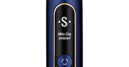 Close-up of SEYSSO Hypertech Infinity Sonic Toothbrush with LED display featuring greeting message.